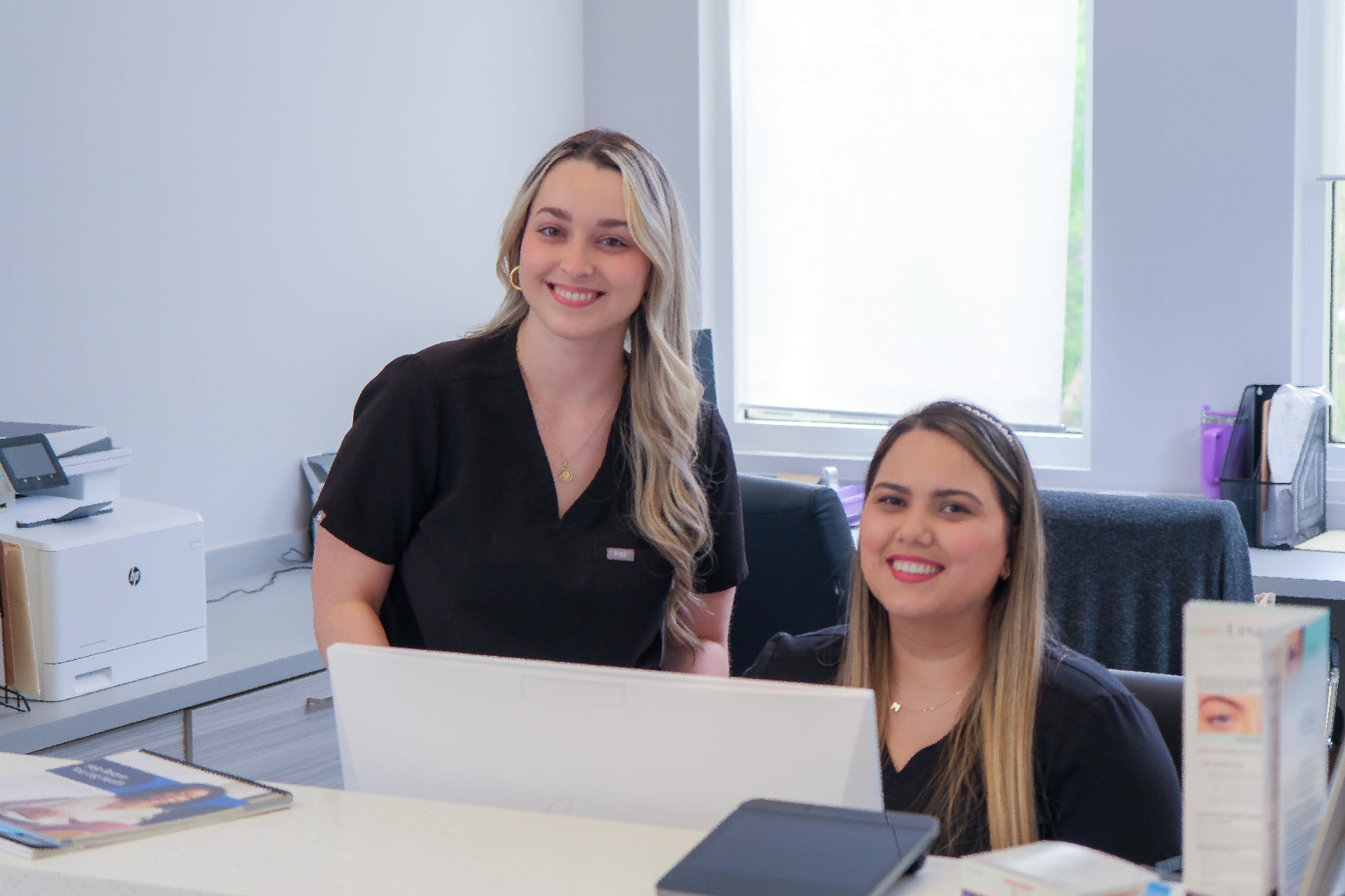 Miami Vein Institute front desk team greeting patients